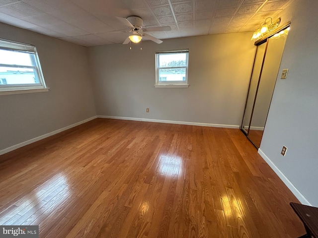 spare room featuring ceiling fan and hardwood / wood-style flooring