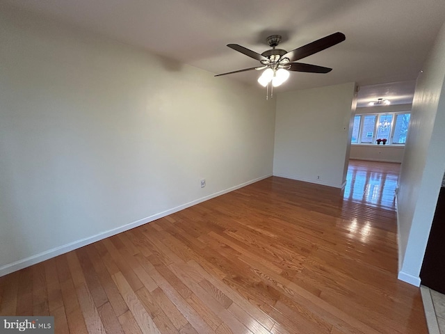 empty room featuring hardwood / wood-style flooring and ceiling fan