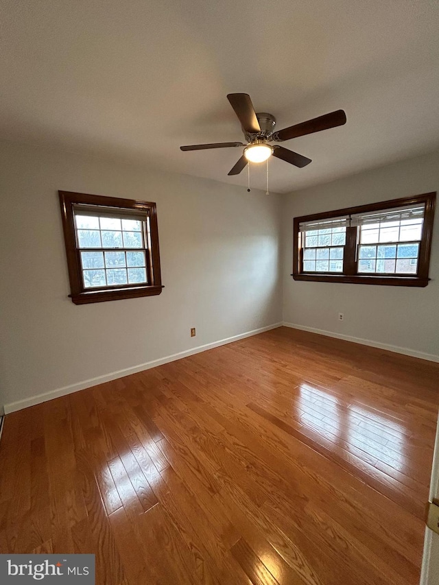 unfurnished room featuring ceiling fan and light wood-type flooring