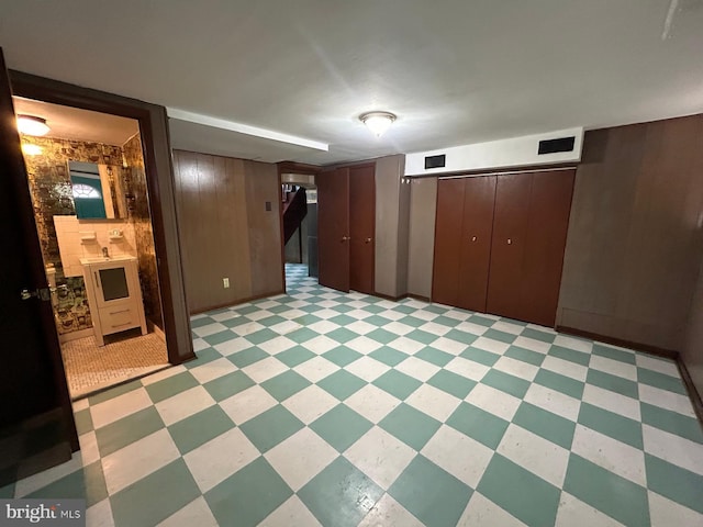 basement with wood walls