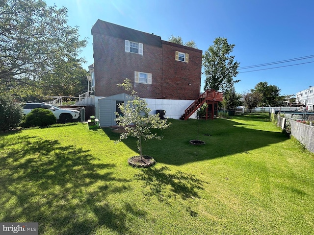 view of side of home featuring a lawn