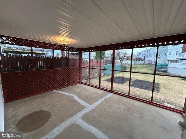 unfurnished sunroom with a wealth of natural light