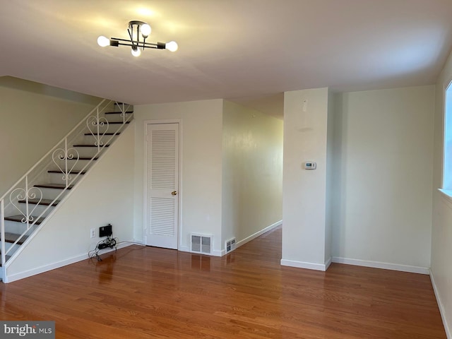 basement with hardwood / wood-style flooring