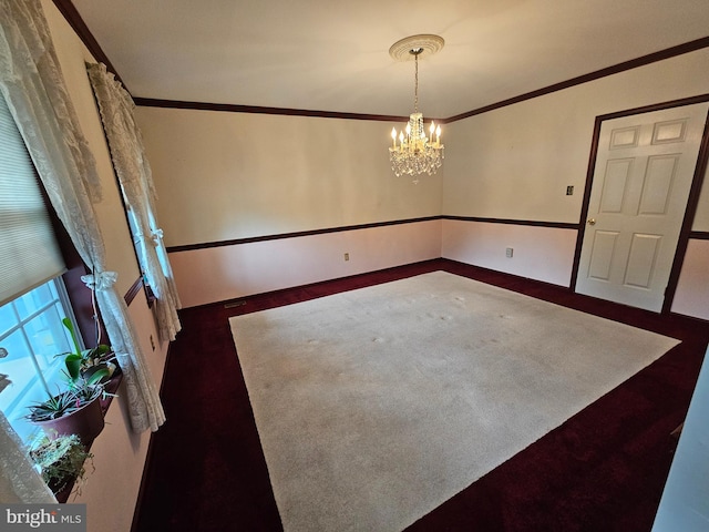 interior space featuring ornamental molding and a chandelier