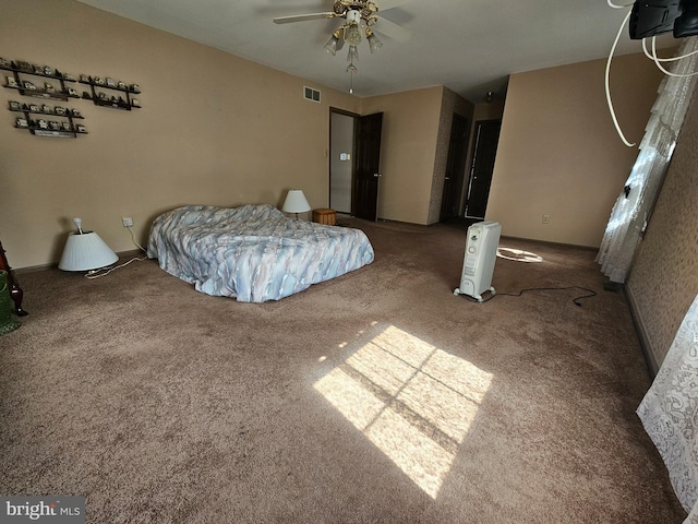 bedroom with ceiling fan and carpet flooring