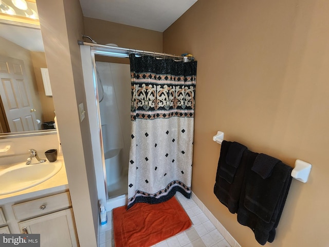 bathroom featuring vanity, tile patterned flooring, and a shower with curtain