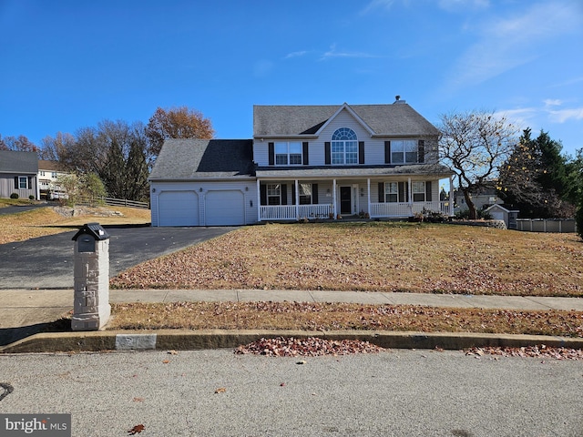 view of front facade with a porch and a garage