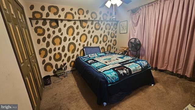 carpeted bedroom with ceiling fan