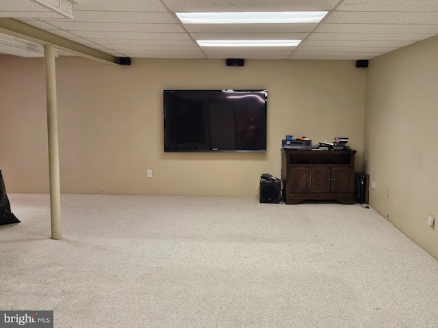 basement with carpet floors and a drop ceiling