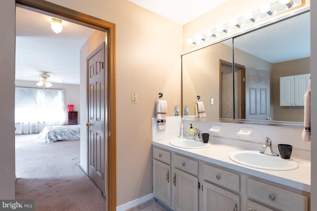 bathroom featuring tasteful backsplash, vanity, and ceiling fan