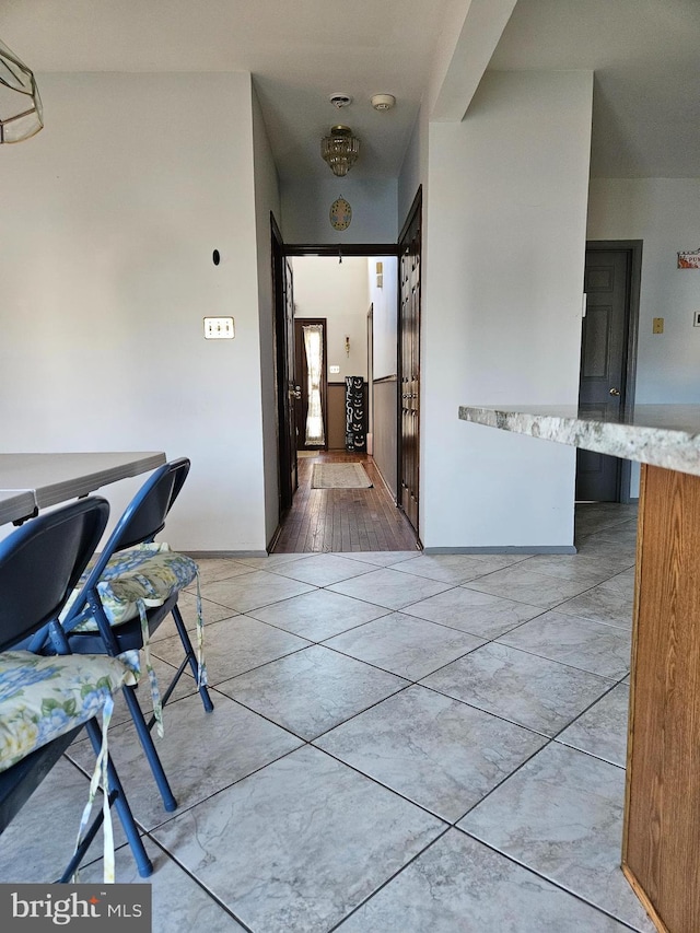 hallway featuring light tile patterned floors