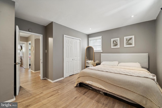 bedroom featuring light hardwood / wood-style floors and a closet