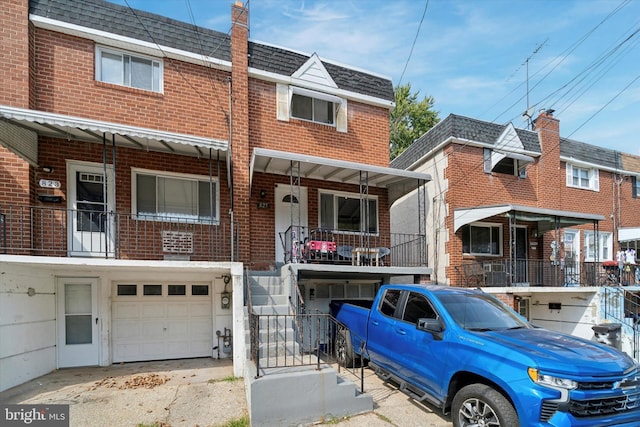 multi unit property featuring a garage