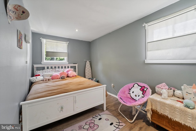 bedroom featuring dark hardwood / wood-style flooring