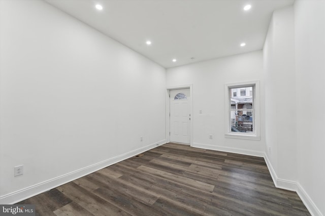 unfurnished room featuring dark hardwood / wood-style floors