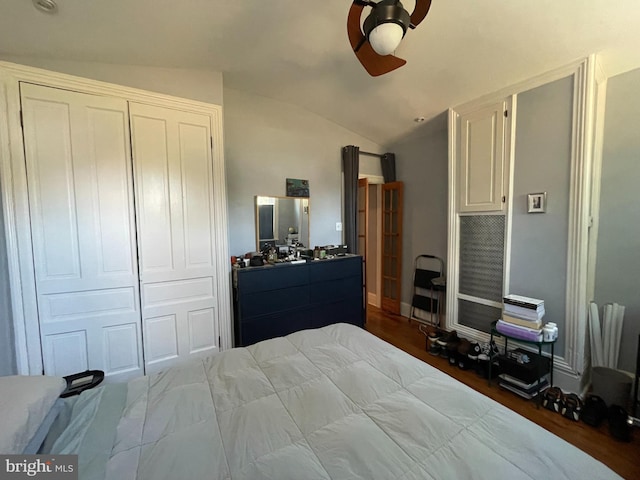 bedroom featuring a closet, vaulted ceiling, ceiling fan, and hardwood / wood-style flooring