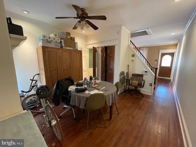 dining space featuring dark hardwood / wood-style flooring, ceiling fan, and crown molding