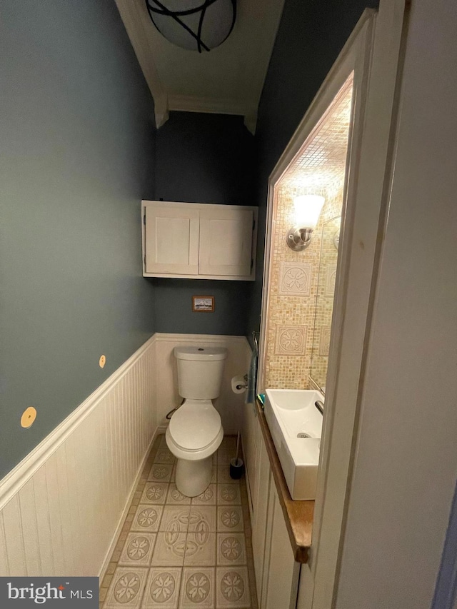 bathroom featuring tile patterned flooring, vanity, and toilet