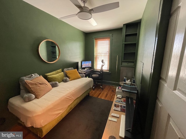 bedroom with hardwood / wood-style floors and ceiling fan