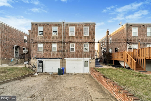 rear view of property featuring a lawn and a deck