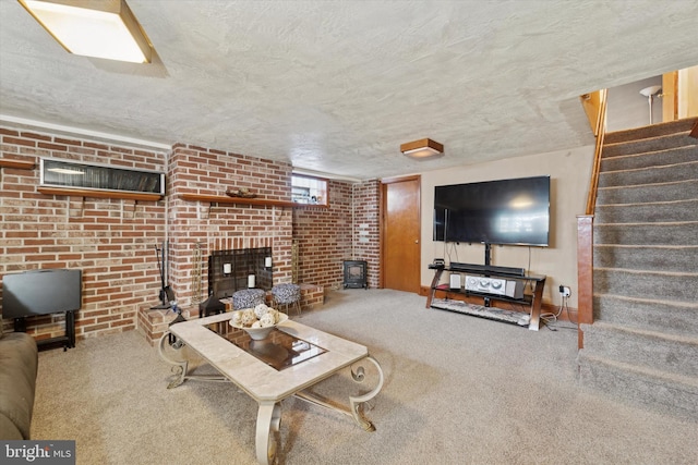 living room featuring carpet flooring, a wood stove, and a textured ceiling