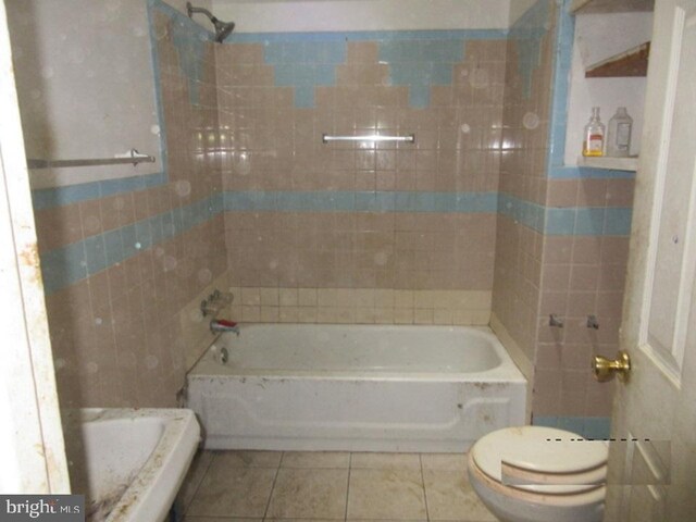 bathroom with tile patterned floors and toilet