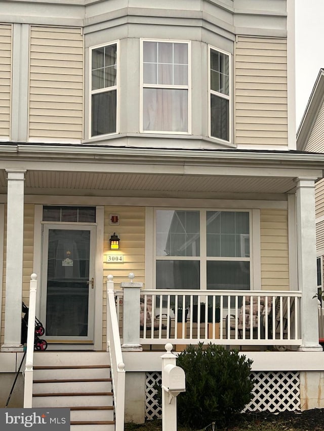 entrance to property with covered porch