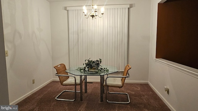 dining room featuring dark colored carpet and a notable chandelier