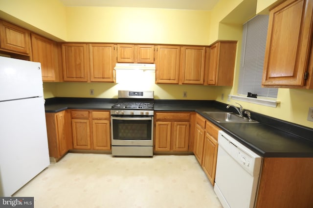 kitchen featuring white appliances and sink