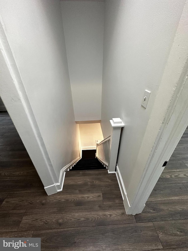 stairway featuring hardwood / wood-style floors