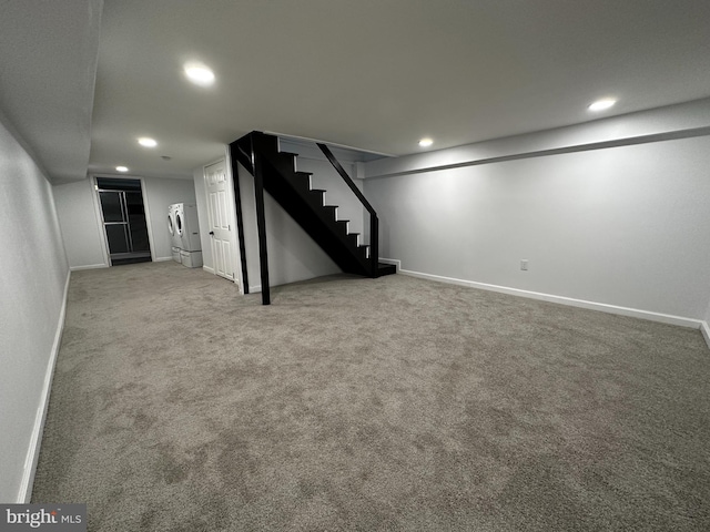 basement with carpet floors and stainless steel refrigerator