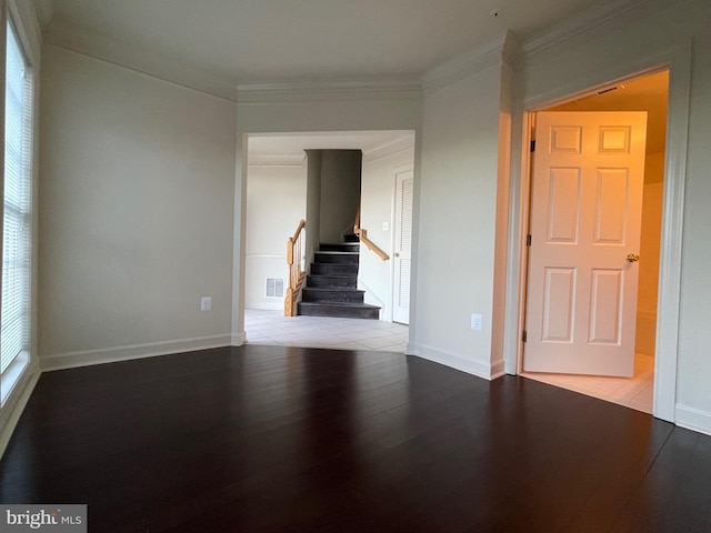 unfurnished room with light wood-type flooring and crown molding