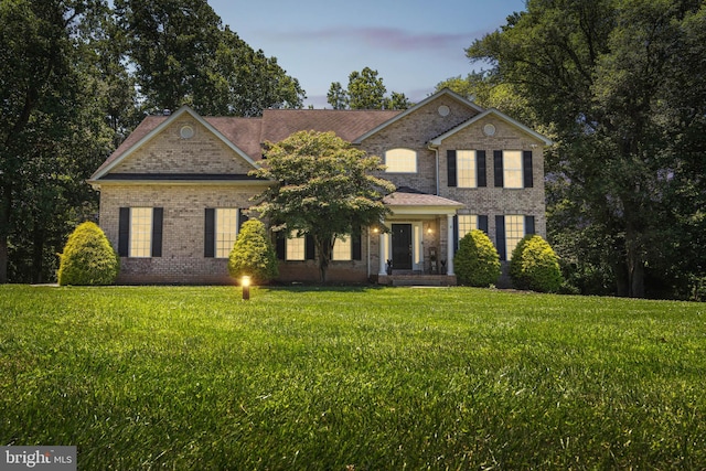 view of front of house with a lawn