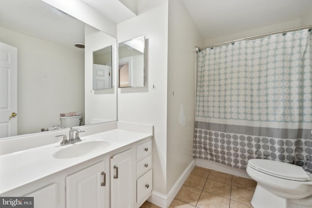 bathroom with vanity, a shower with curtain, tile patterned floors, and toilet