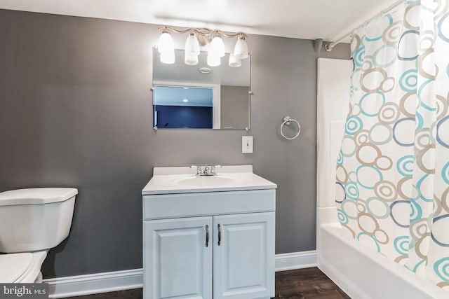 full bathroom featuring vanity, hardwood / wood-style flooring, toilet, and shower / bath combo