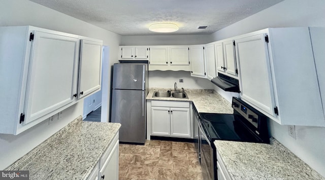 kitchen with sink, stainless steel fridge, black electric range, a textured ceiling, and white cabinets