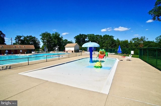 view of swimming pool with a patio area