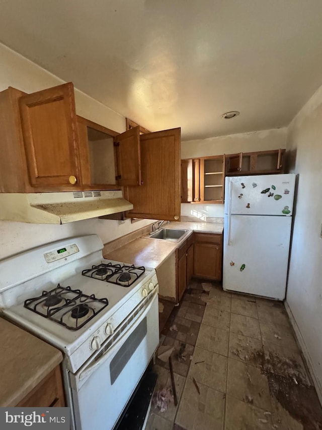 kitchen with sink and white appliances