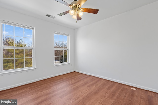 unfurnished room with ceiling fan and light hardwood / wood-style flooring