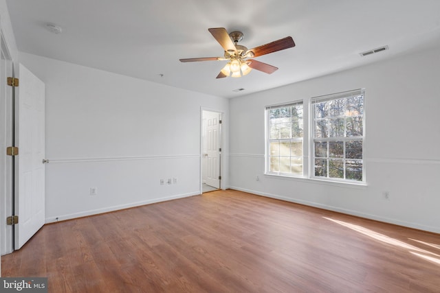 spare room with ceiling fan and hardwood / wood-style floors