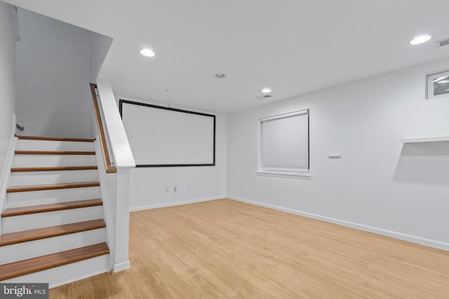 cinema featuring light hardwood / wood-style floors