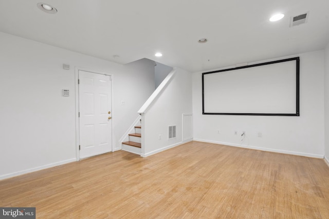 home theater room with light wood-type flooring