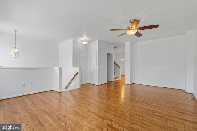 unfurnished room with ceiling fan and light hardwood / wood-style flooring