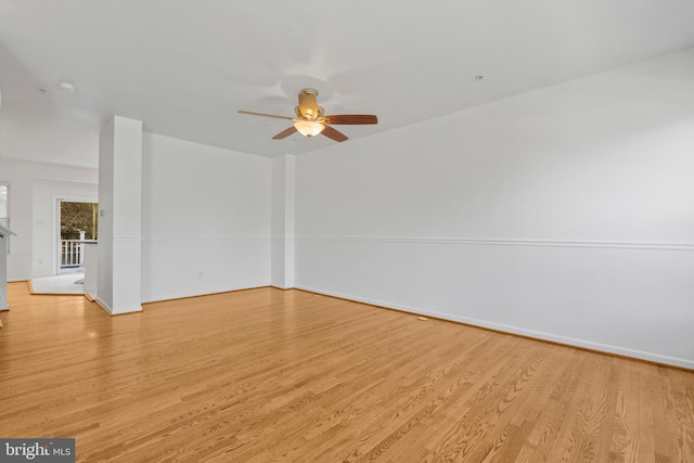 unfurnished room with ceiling fan and light wood-type flooring