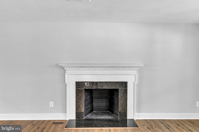 interior details featuring hardwood / wood-style flooring