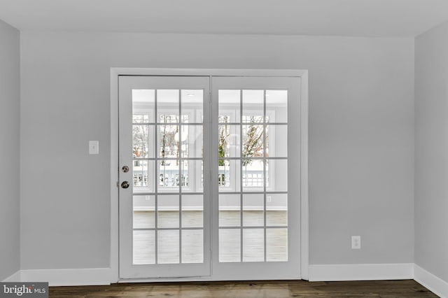 entryway with dark hardwood / wood-style floors