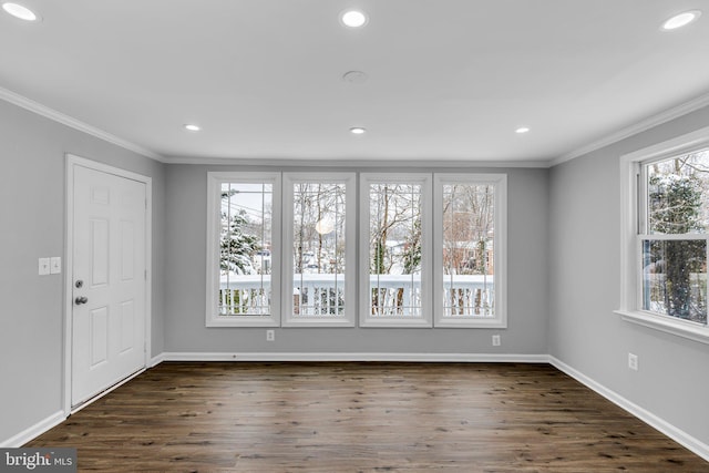 unfurnished room featuring dark hardwood / wood-style floors and ornamental molding