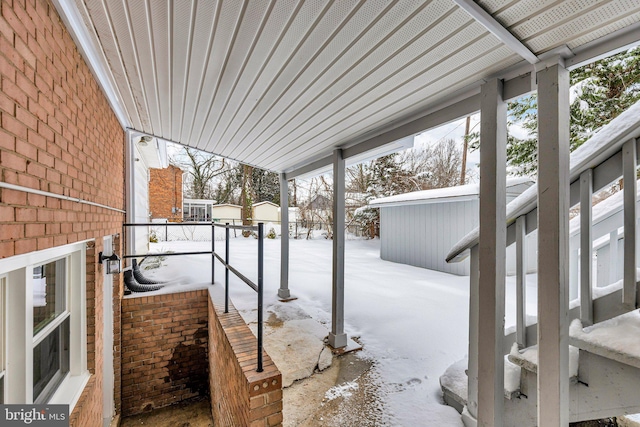 view of snow covered patio