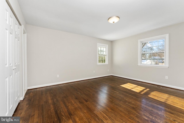 unfurnished bedroom featuring hardwood / wood-style flooring