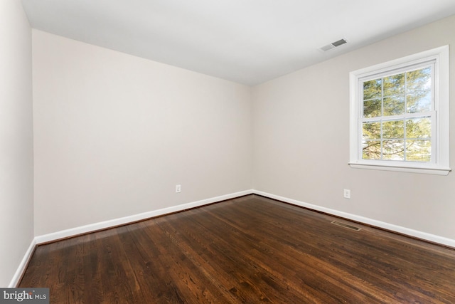 empty room featuring hardwood / wood-style floors